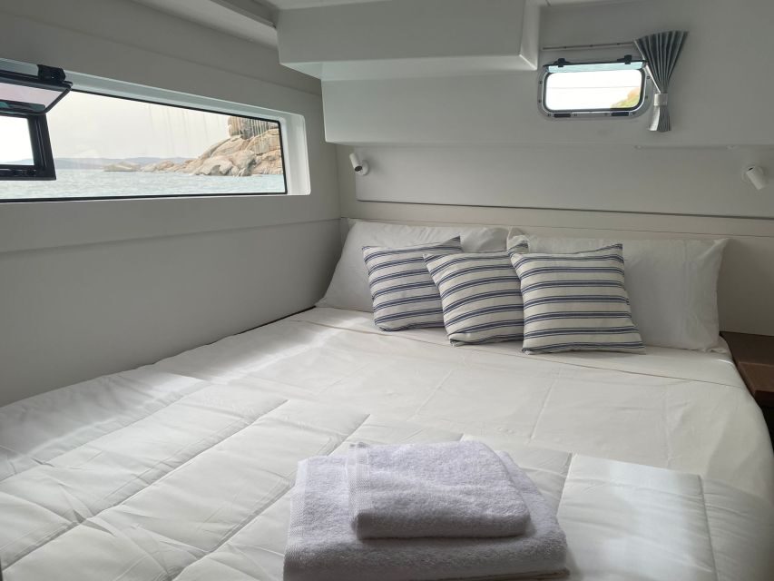 Archipelago di La Maddalena: Catamaran Tour Full day-Lunch - La Maddalena National Park: aperitif, photos, snorkeling, and onboard food