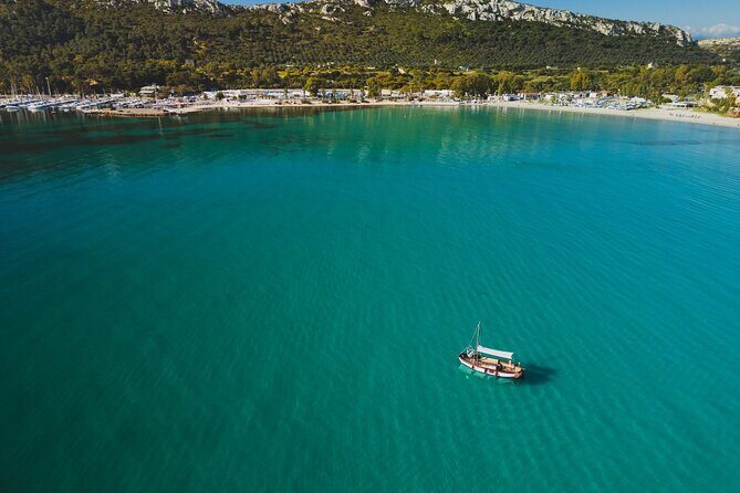 Cagliari : Gozzo Tour with 3 Swim Stops, Snorkeling & Local Food - Stop 4: Spiaggia di Cala Fighera for Limestone Cliffs and Fossils (30 minutes)