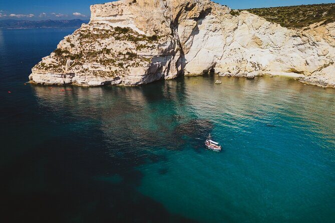 Cagliari : Gozzo Tour with 3 Swim Stops, Snorkeling & Local Food - Stop 1: Cala Bernat for Quiet White Sand and Clear Water (20 minutes)