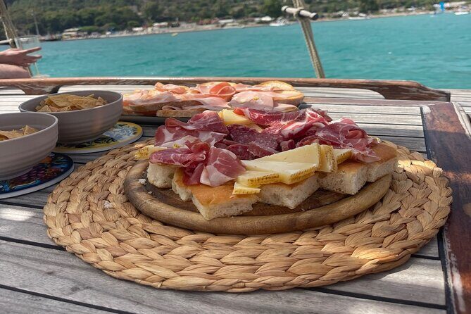 Cagliari Gulf Boat tour : 5 stops, snorkeling & local aperitif - Stop-by-stop: Cala Bernat, Calamosca, Cala Fighera, Sella del Diavolo, Poetto