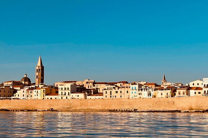 One day excursion on a sailing boat in the Gulf of Alghero - First stop near Grotte di Nettuno: Capo Caccia from street-level height… but at sea level