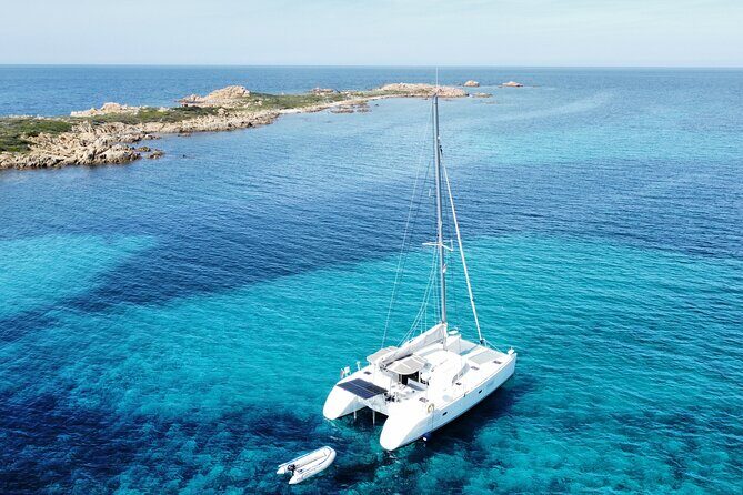 Private catamaran sailing trip around La Caletta -Berchida - Sardinia - Stop 2: Santa Lucia for a change of pace on the same sail