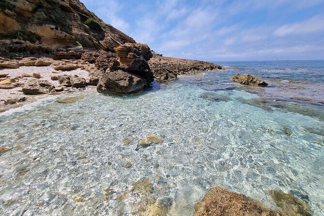 Secret Beaches and Coastal Tour by Land - Palmadula’s Cliffs and Water Color You’ll Want to Stay With